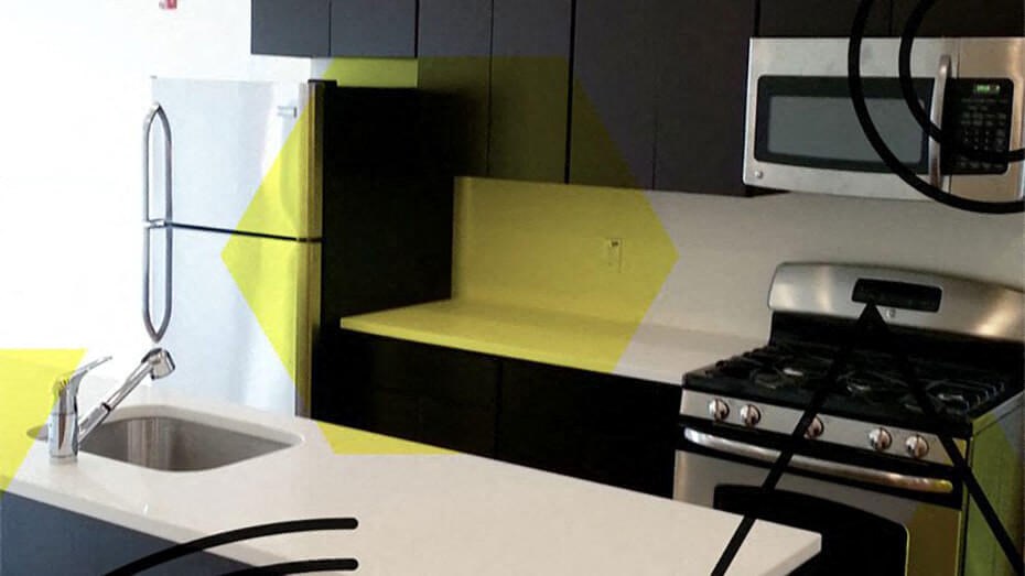 a kitchen with a stove a sink and a microwave