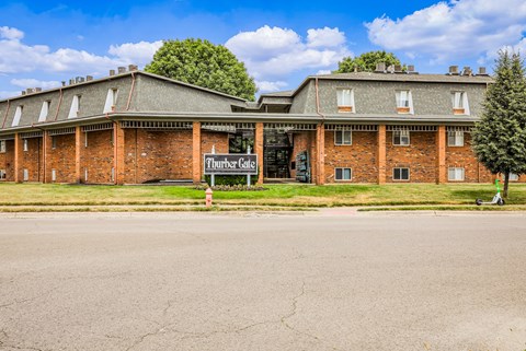 A large brick building with a sign that says Thunder Cave.
