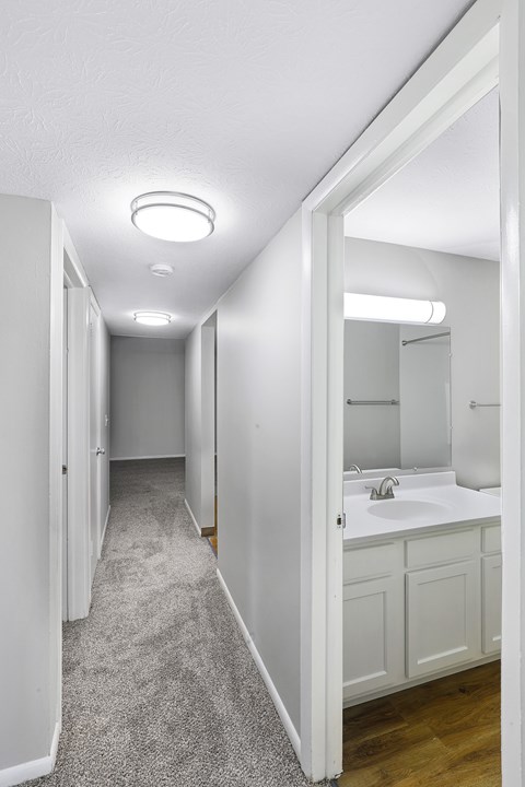 A bathroom with a sink and mirror.