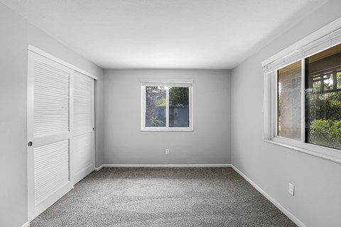 A room with a window and a door.