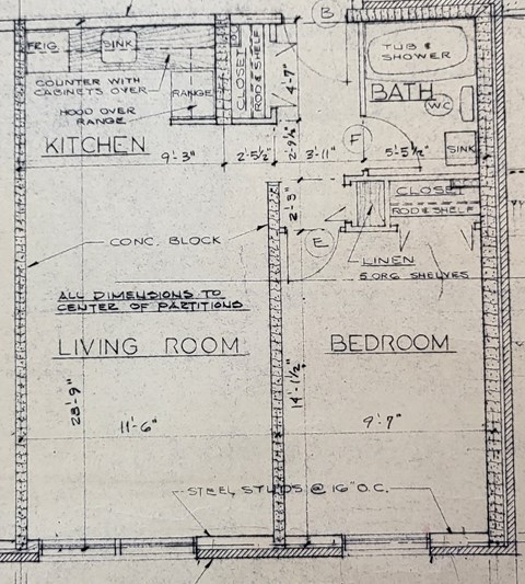 a drawing of a plan of a living room and a kitchen