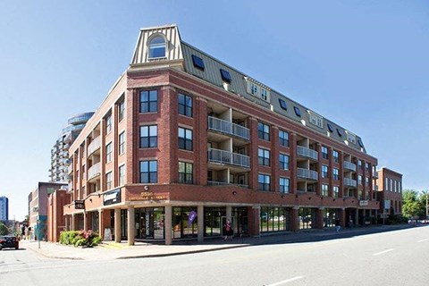 a large brick building on the side of a street