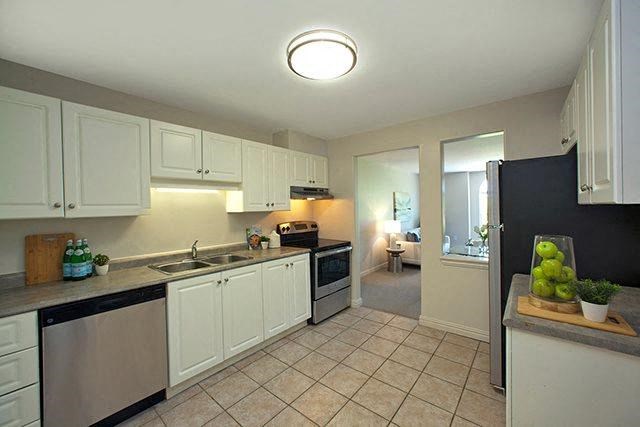 a kitchen with a sink and a refrigerator