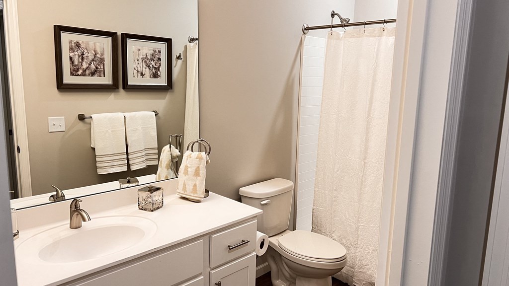 Guest bathroom with a bathtub and shower