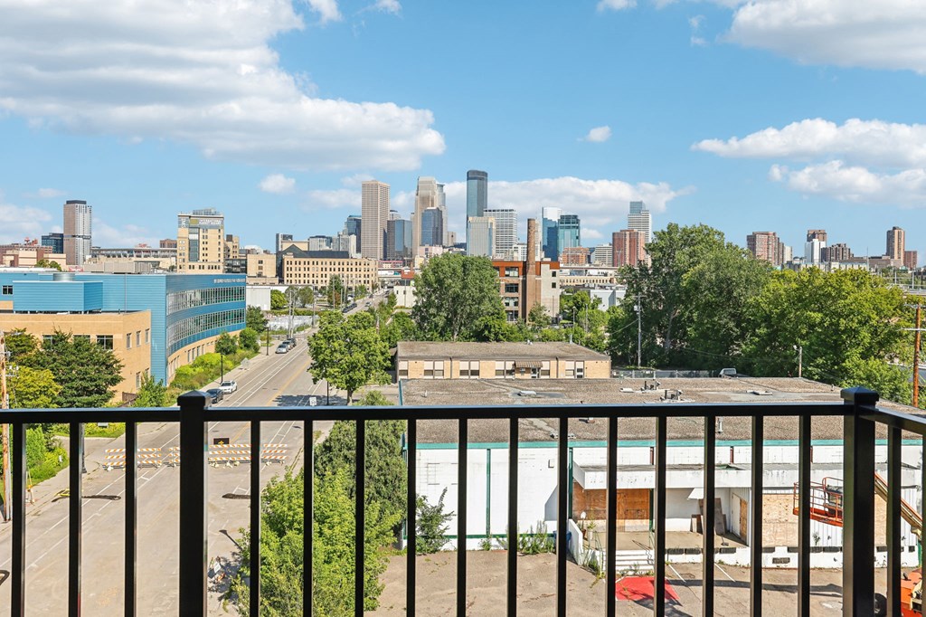 a balcony with a view of the city