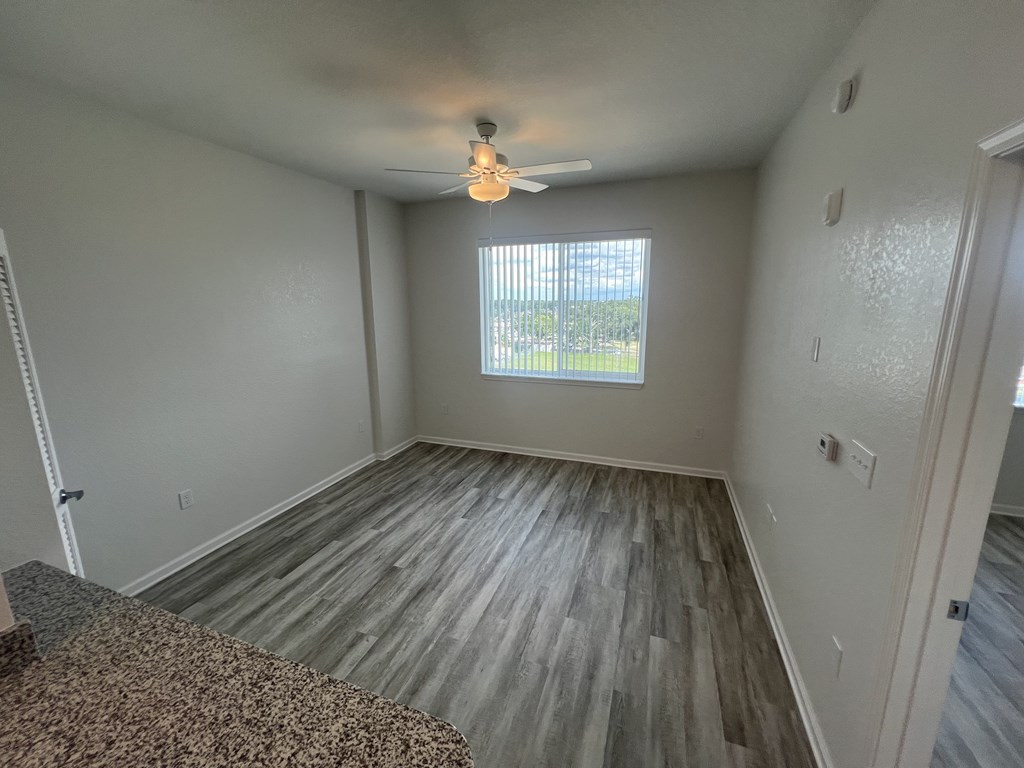 A room with a window and a ceiling fan. Madison Highlands 2 Tampa Florida
