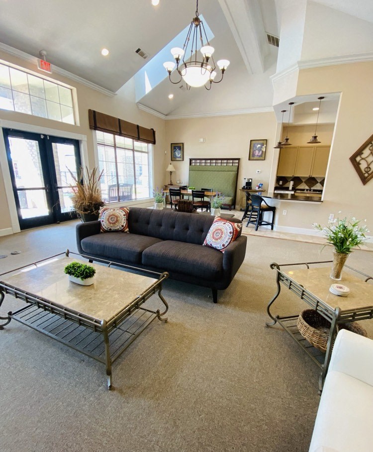 a living room with a couch and a table