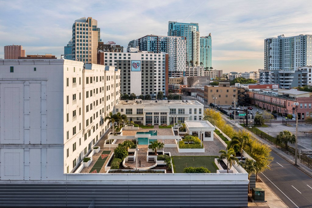 an aerial view of a city with tall buildings and a park