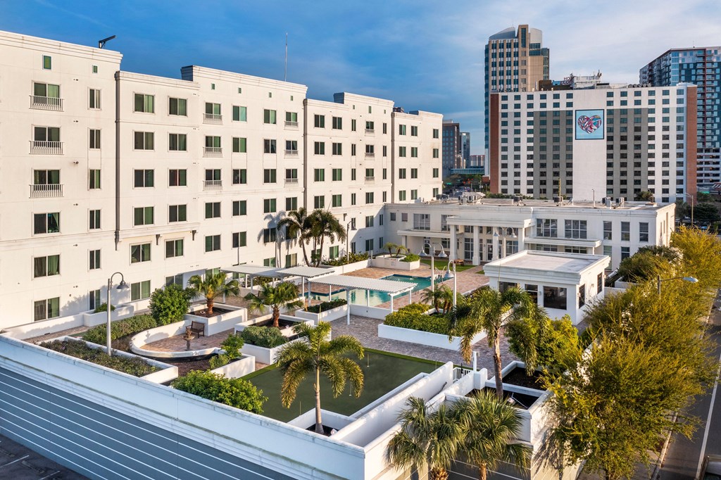 a view of the hotel from the roof of a building with palm trees