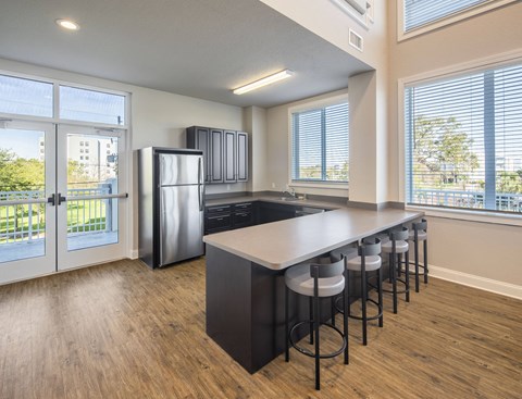 the preserve at ballantyne commons apartment kitchen and island with stools