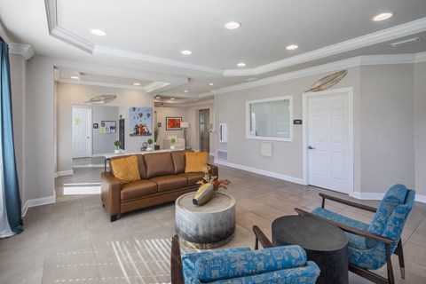 a living room with couches and chairs and a table