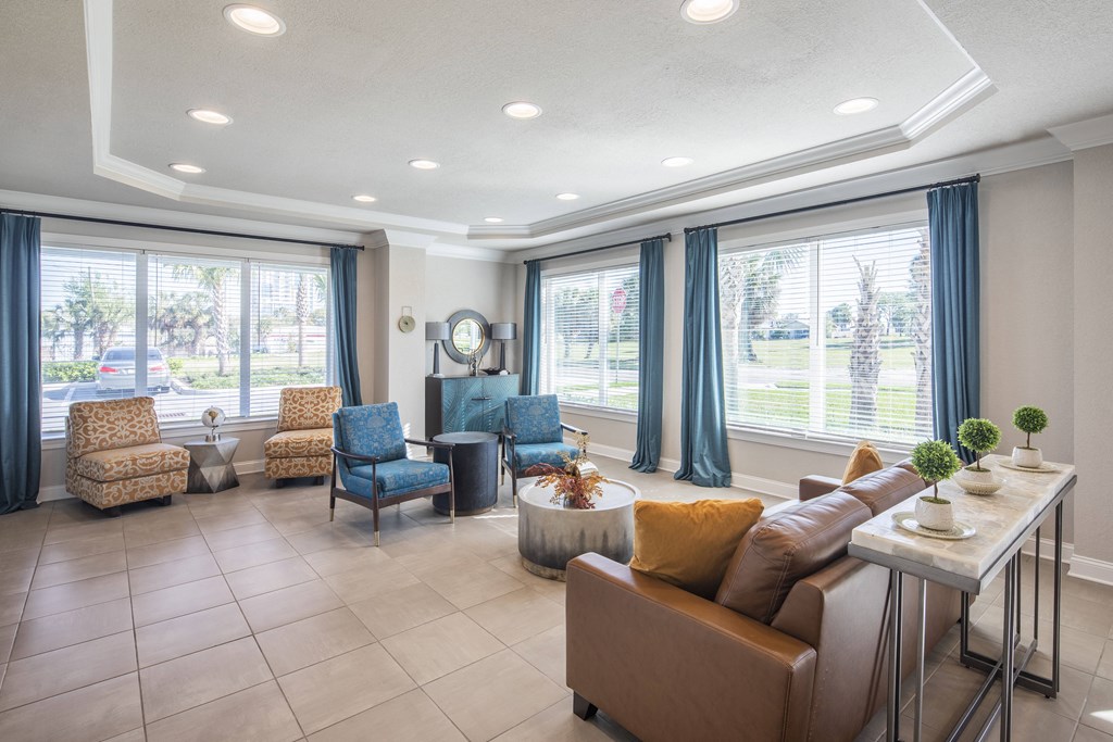 a living room with couches and chairs and a table