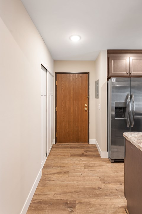 Front entry with large storage closets at Santa Vera Apartments.