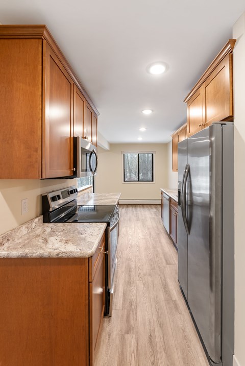 Kitchen and dining area in a 1-bedroom unit at Santa Vera Apartments.