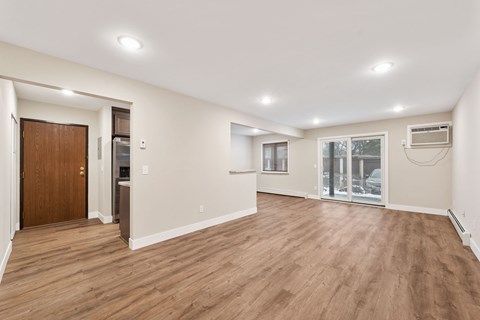 Large living room space wooden floors at Santa Vera Apartments in Chanhassen.