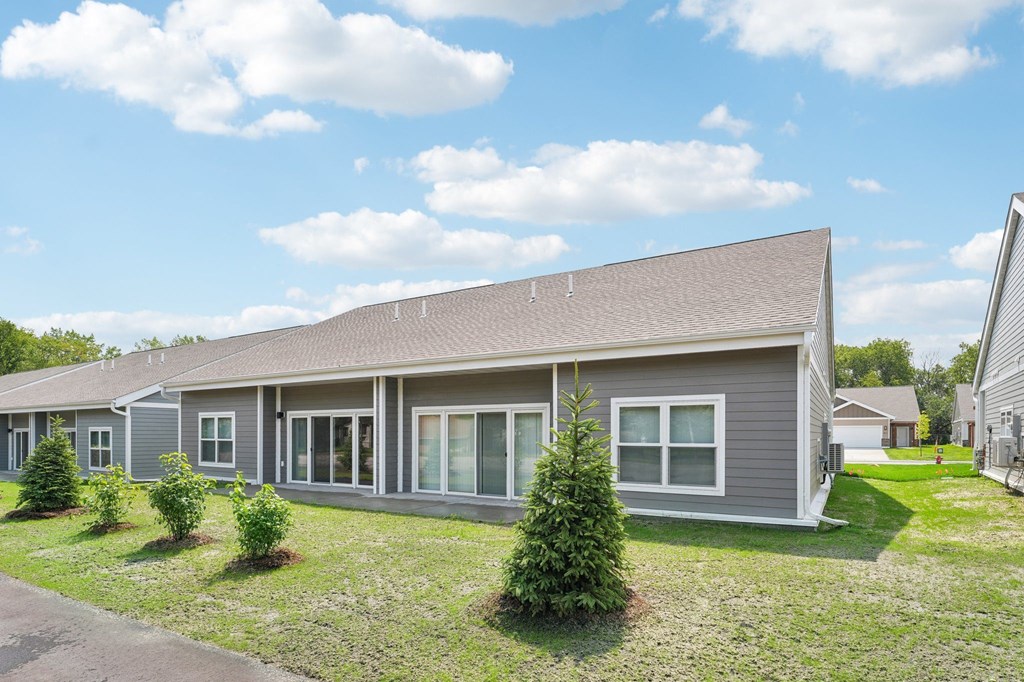twin home back yard with a small patio