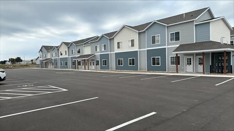 an empty parking lot in front of a building