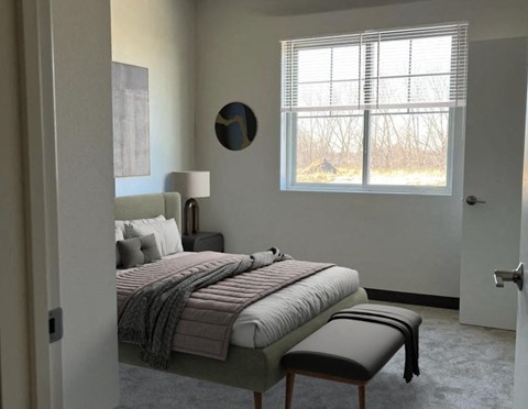 a bedroom with a bed and a window