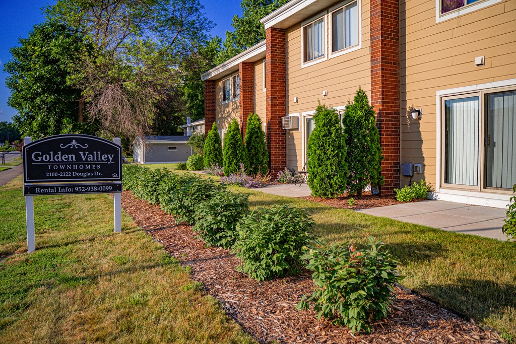 the residences at golden valley apartments sign in front of building