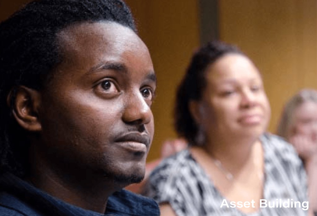 A man and a woman are sitting in a room.
