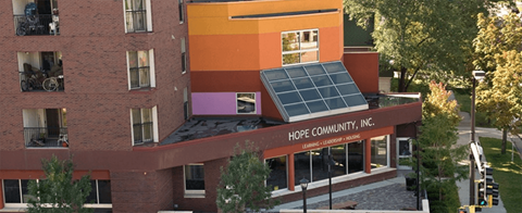 A building with a Hope Community Inc. sign on the front.