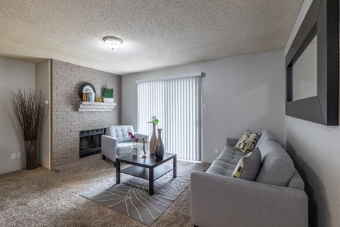 the living room of an apartment with a couch and a coffee table