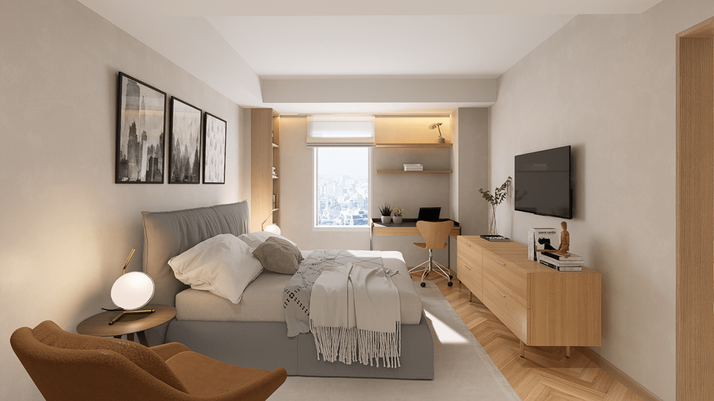 a bedroom with a bed and a desk and a tv