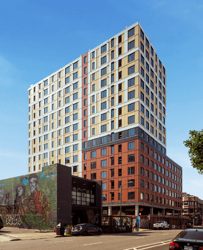a tall apartment building with a mural on the side of it  at Andys at 1510 Webster Street, Oakland, California