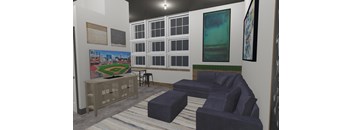 A room with a baseball field painting on the wall and a blue couch.