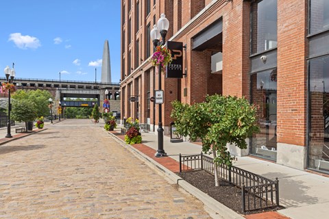 A brick building with a sign that says Pepper on it.