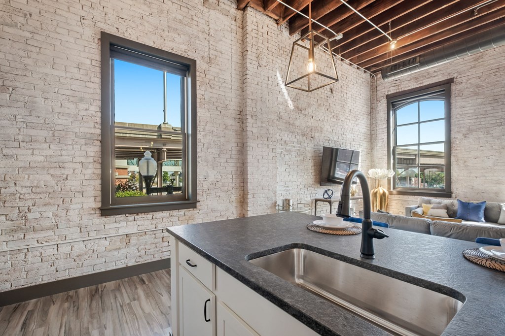 a kitchen with a sink and a window