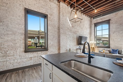 a kitchen with a sink and a window