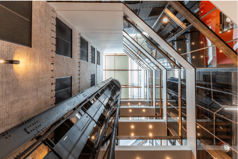 a view of the atrium from the escalator in the center of the building