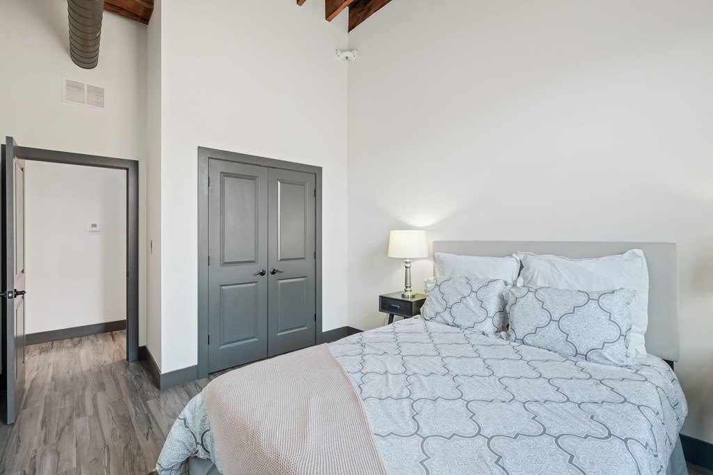 a bedroom with a bed and a closet