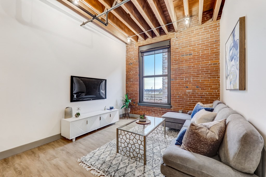 a living room with a couch and a tv
