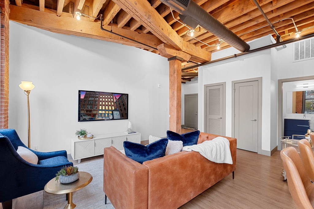 a living room with a couch and a tv