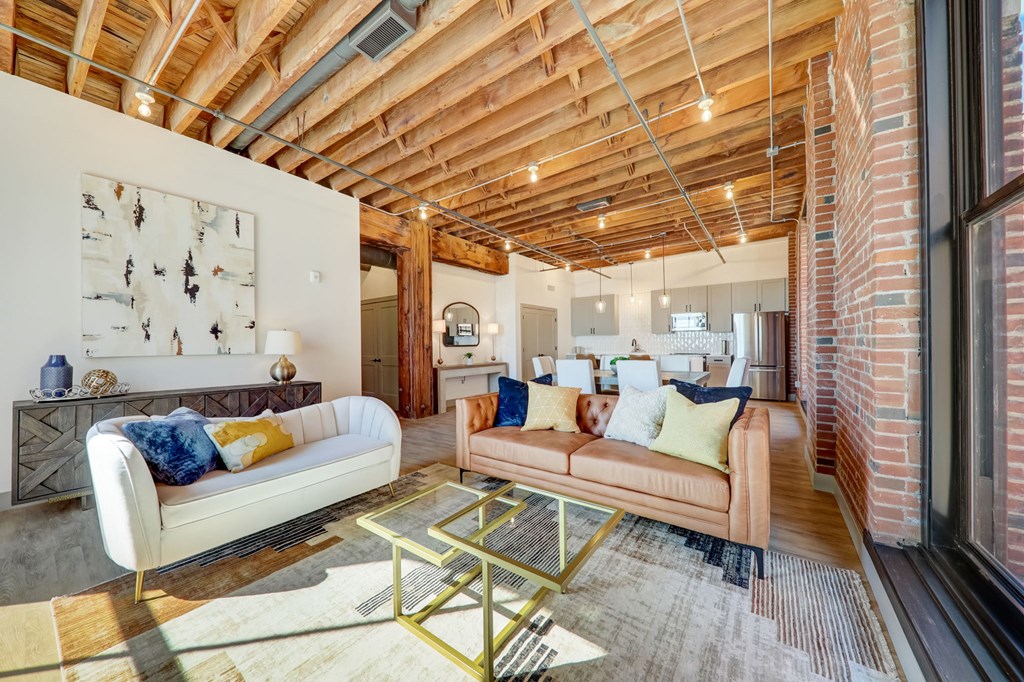 a living room with a couch and a table at Greeley Lofts, St. Louis, MO
