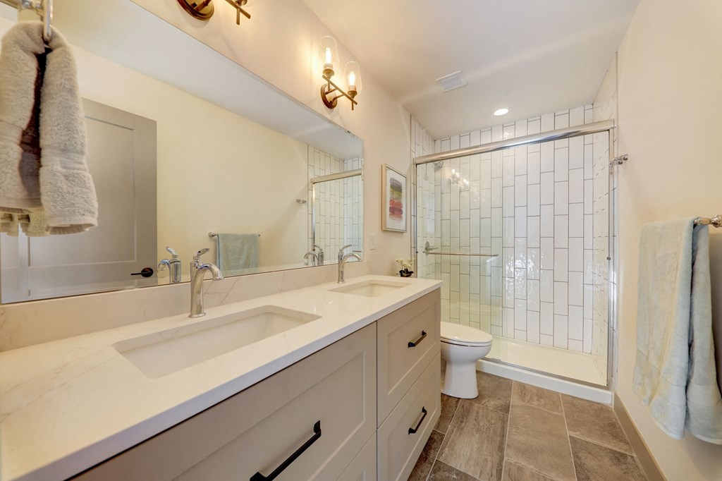 a bathroom with a sink and a shower and a toilet at Greeley Lofts, Missouri, 63102