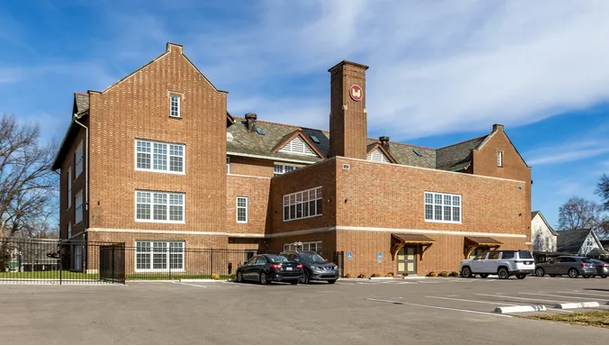 a large brick building with a clock tower