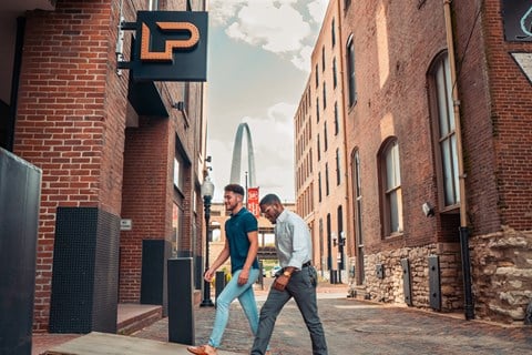 two men walking down the street