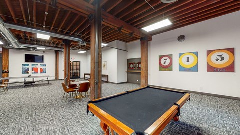 a game room with a pool table