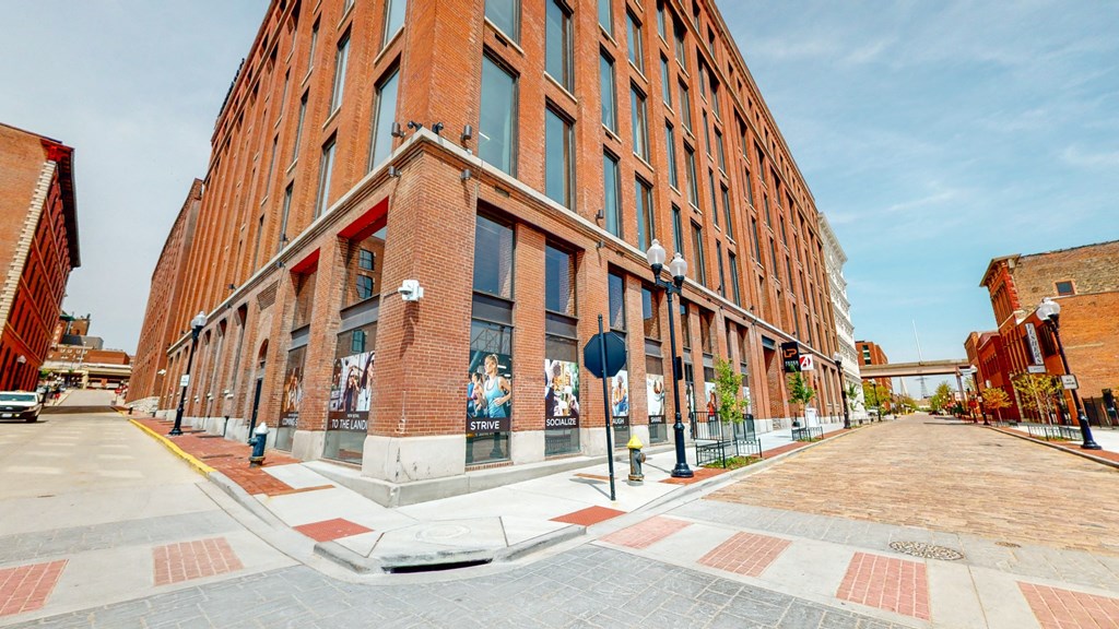 a large brick building on the corner of a street