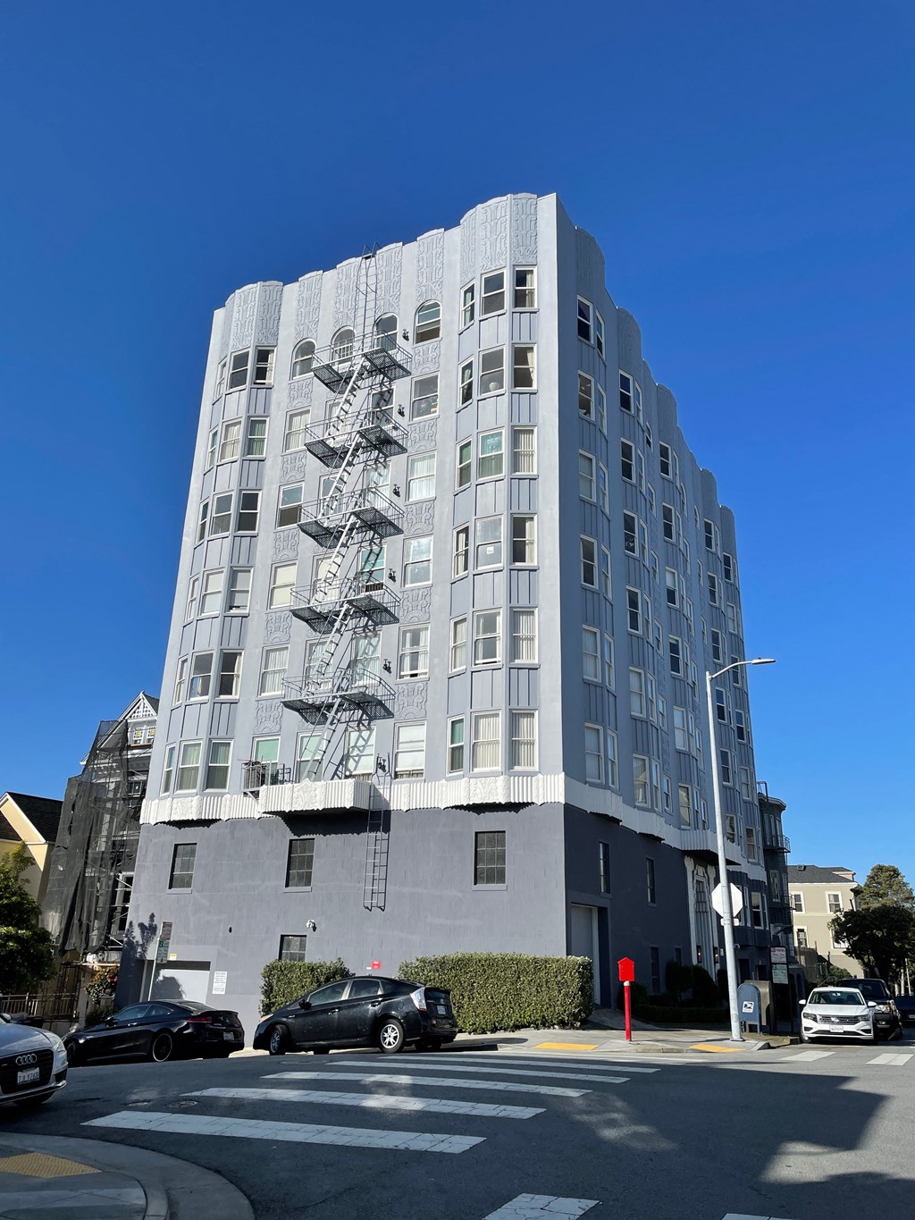 a painting on the side of a building on a city street