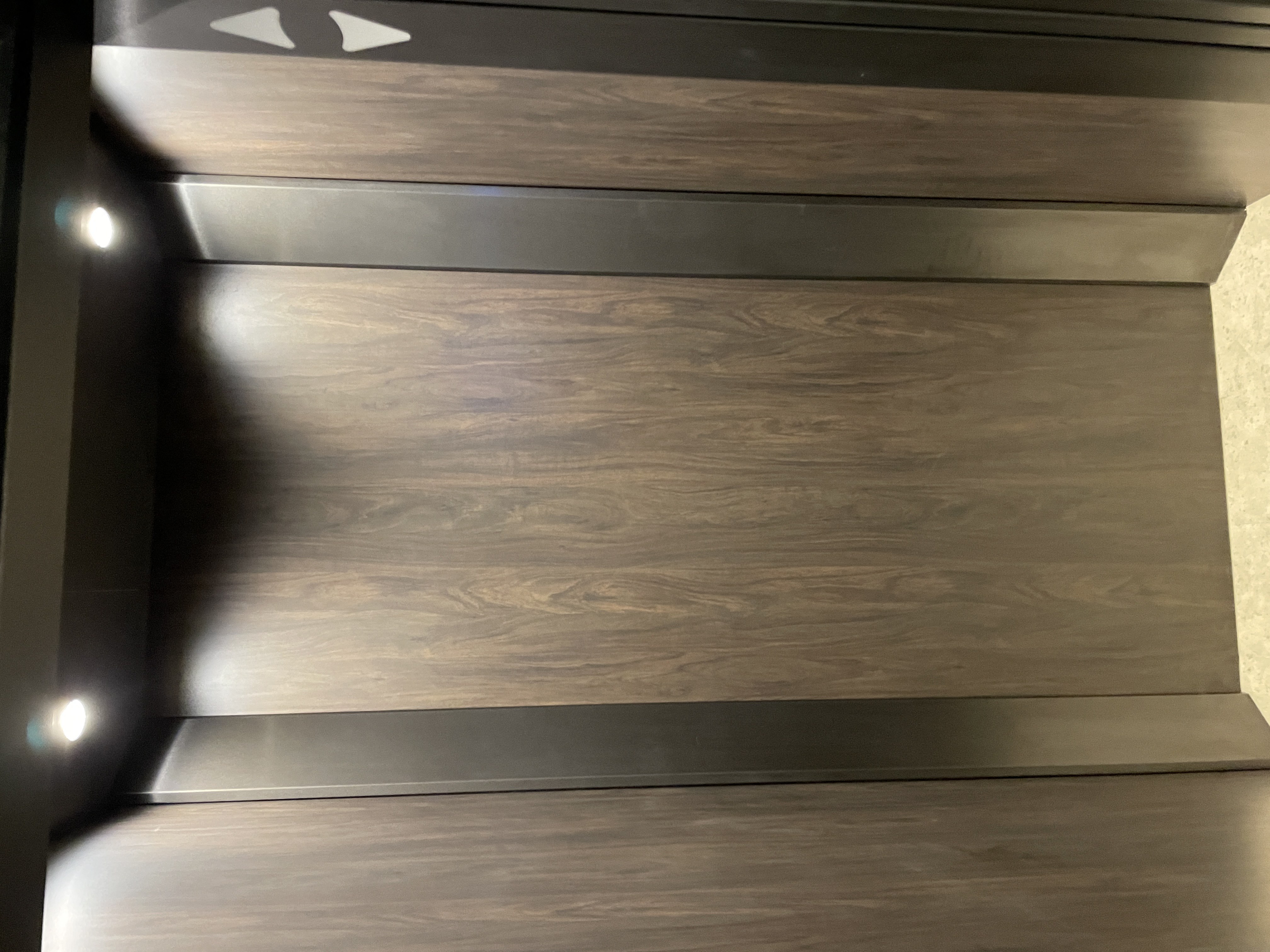 the stairs are made of wood and stainless steel