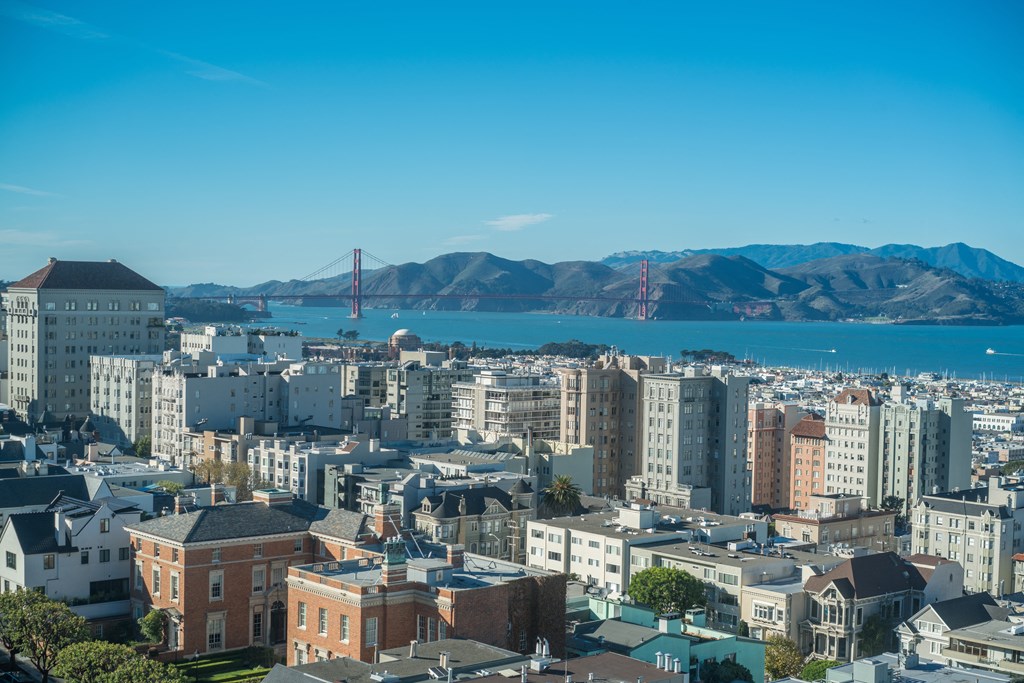 a view of the city and the bay bridge in the background