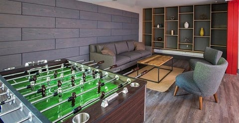 a living room with a table with a football game on it
