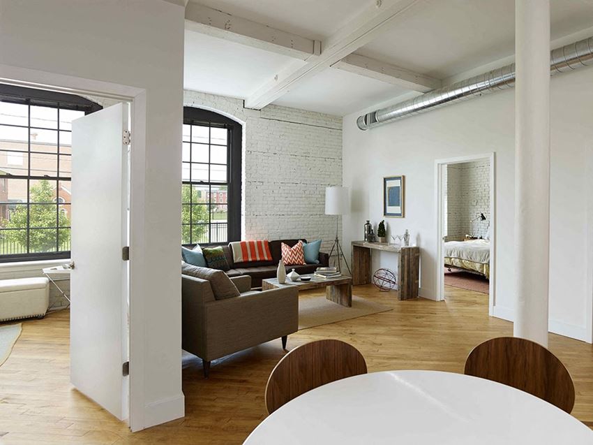a living room with a couch and a table
