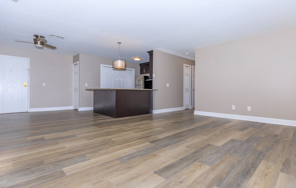 the living room and kitchen in a 555 waverly unit