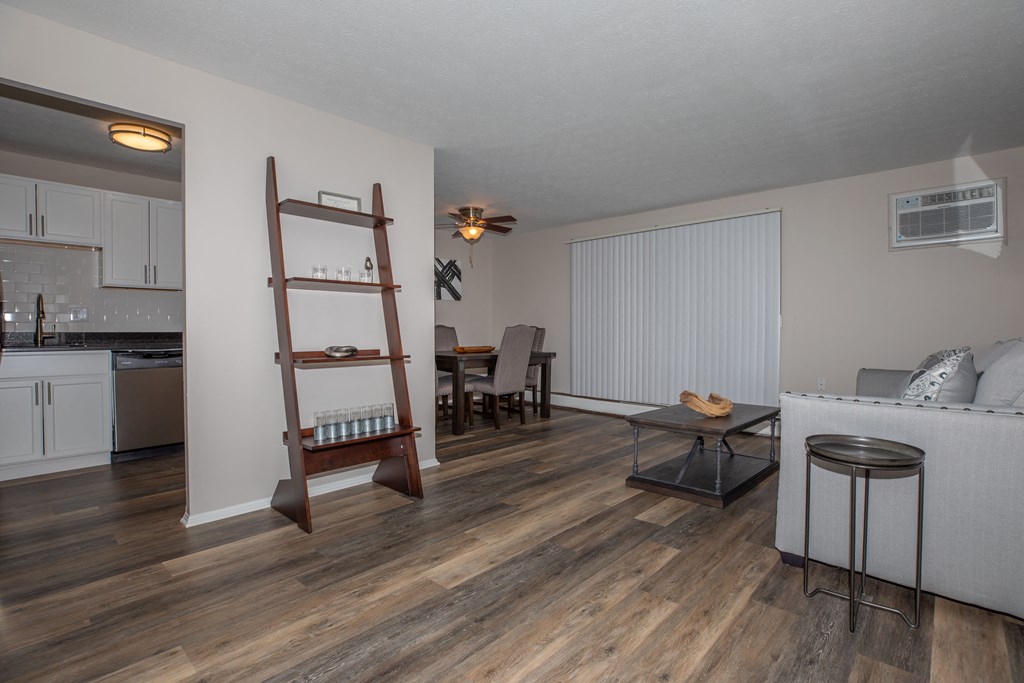 a living room and dining room with hardwood floors
