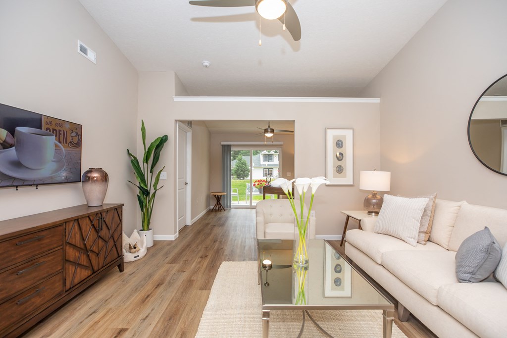 Furnished living room overlooking den